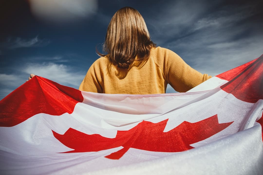 French-language support animal — woman holding Canada flag