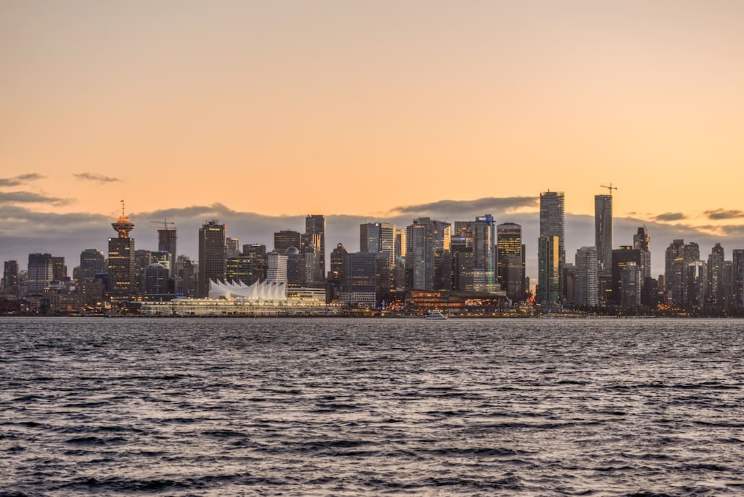 discrimination complaint — A view of a city from the water at sunset