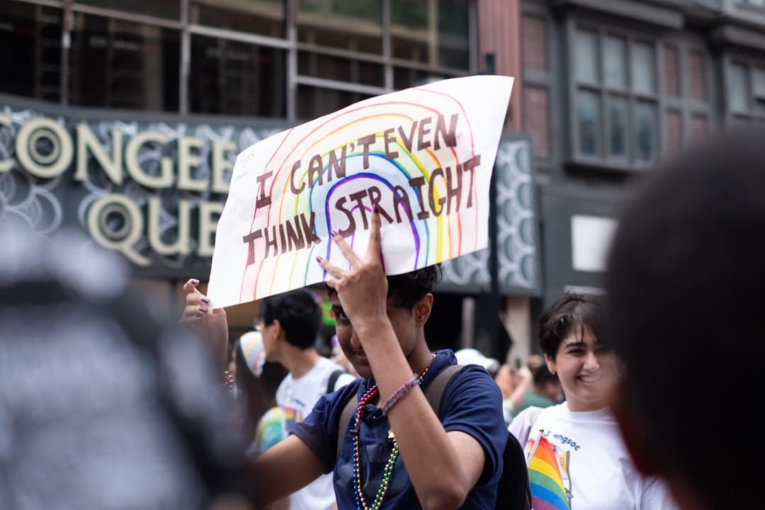 PIPEDA privacy rights — A man holding a sign in the middle of a crowd