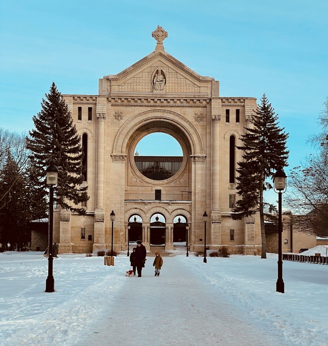 air canada service dog — people walking on snow covered pathway near brown concrete building during daytime
