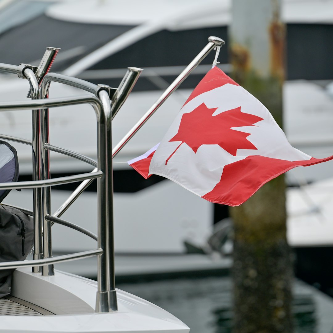 support animal territorial rights — The canadian flag flies on a yacht